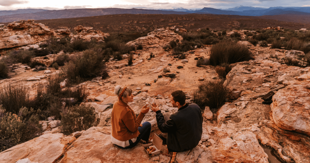 Couple enjoying sundowners at the lookout point
